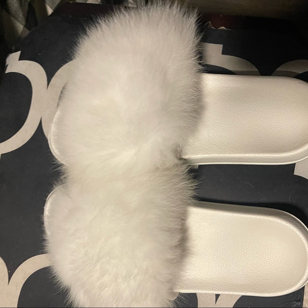 White fox fur slides in size 10-11 more 11 if you ask me. Mint condition .